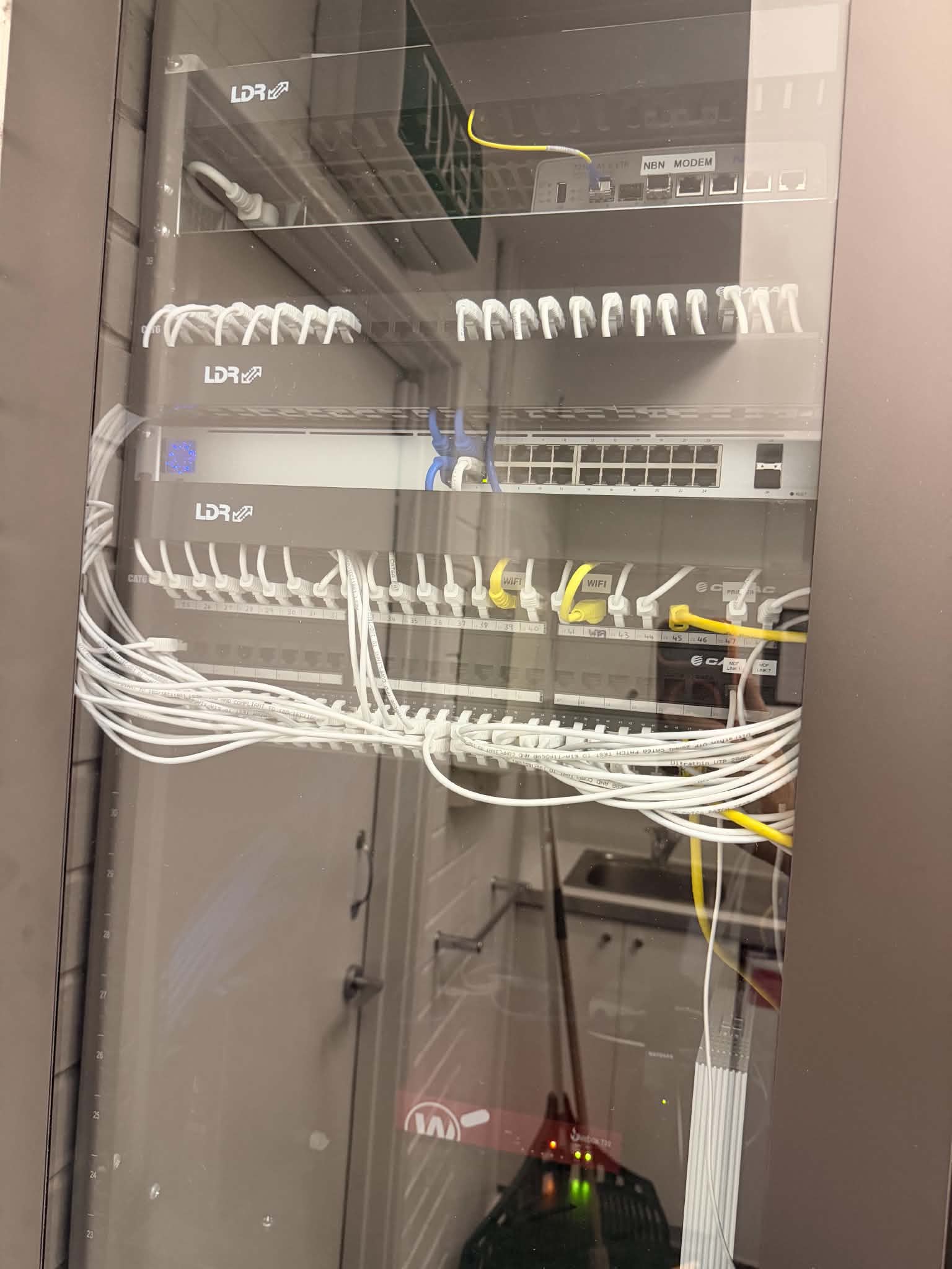 Completed business network cabinet after AY Technology organisation work